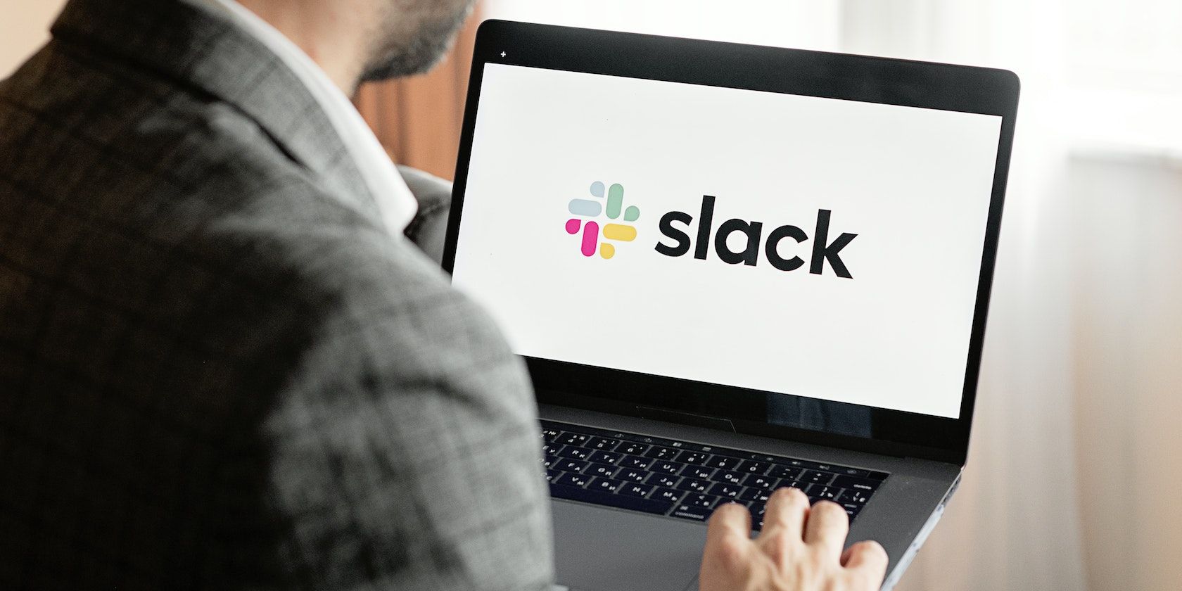 A person using slack on a laptop