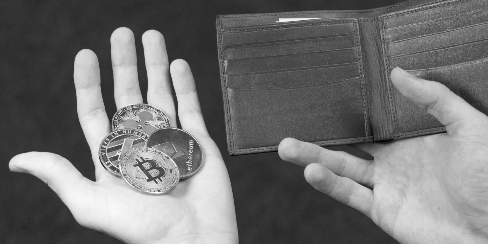 person holding wallet and cryptocurrency coins in hands
