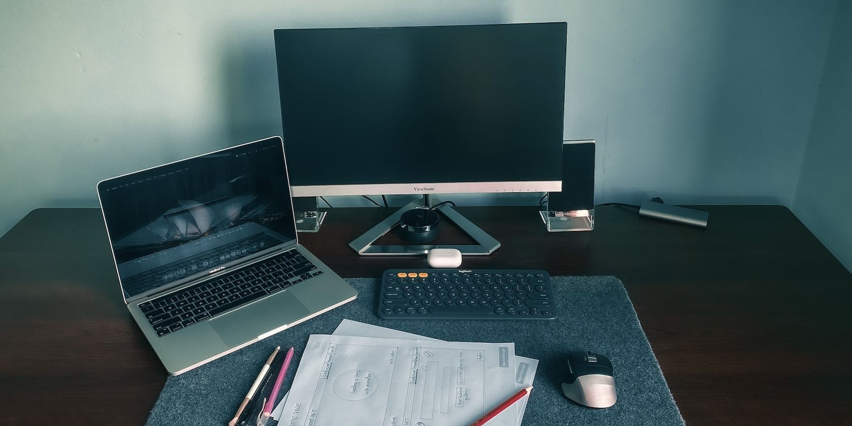 A Desktop And A Laptop On Table