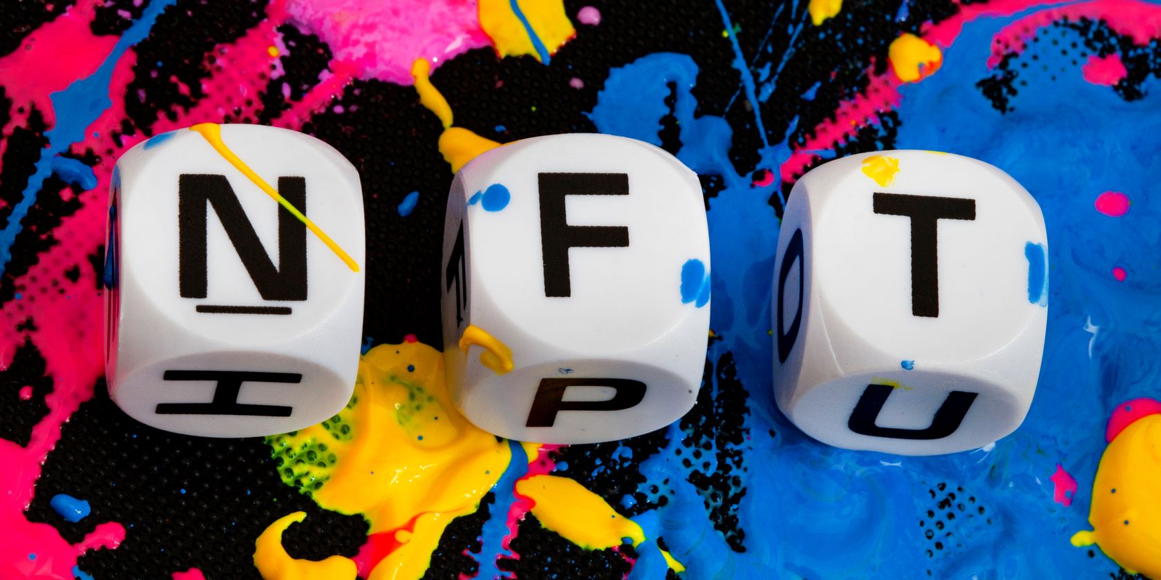 dice spelling nft on paint background feature