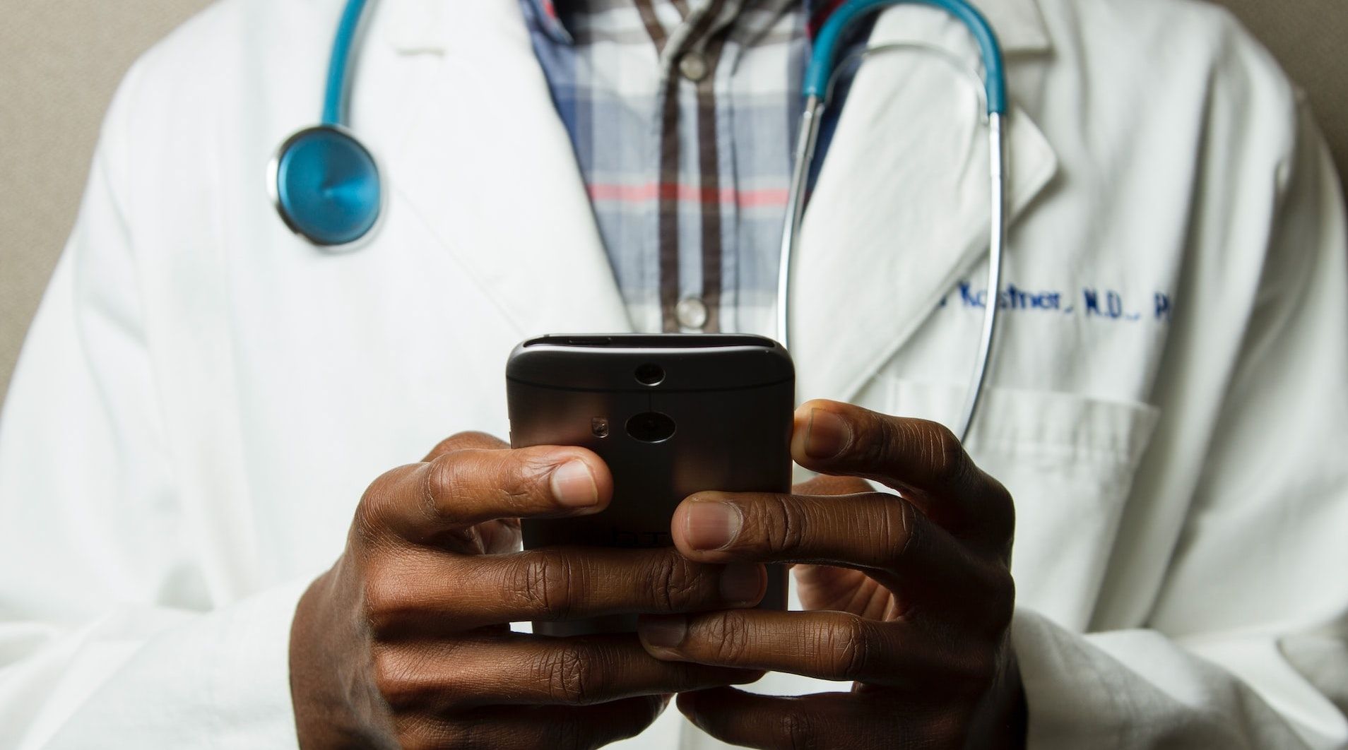 Medical Doctor Texting on a Smartphone