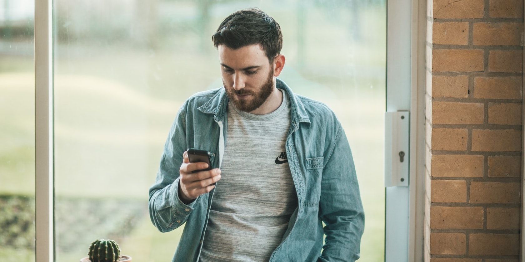 Man Texting on Smartphone