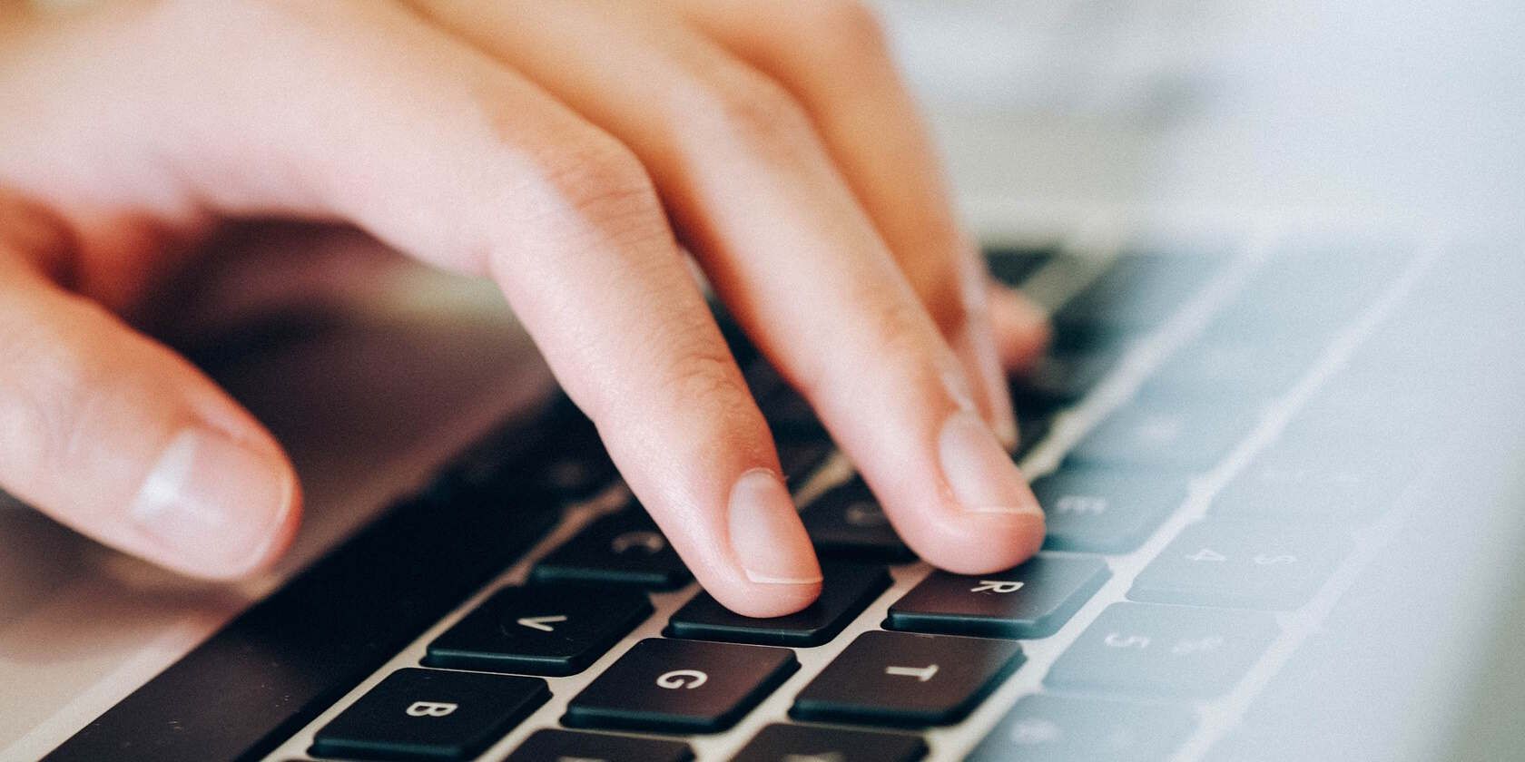 Fingers Typing on a Laptop Keyboard
