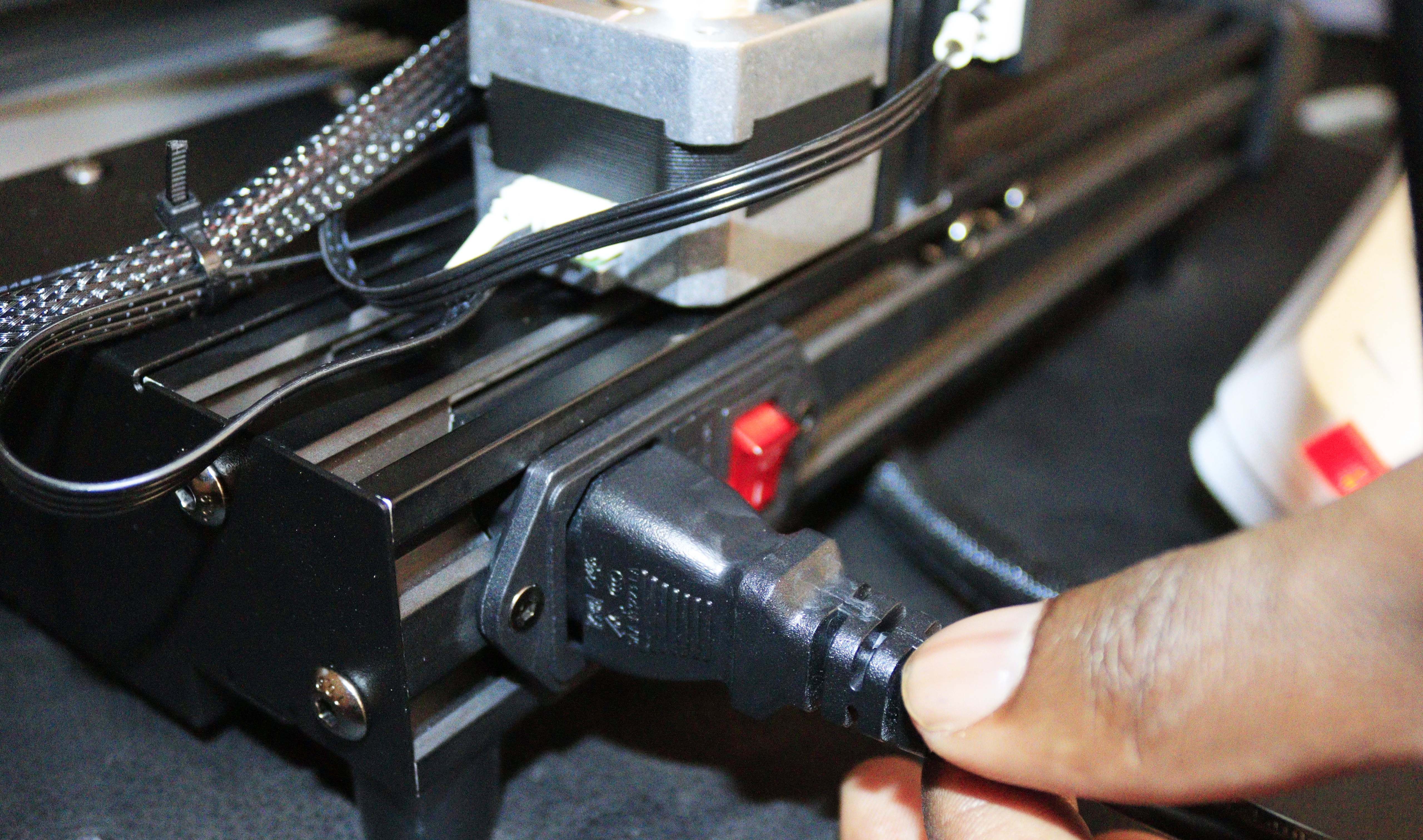 Placing the power cord to the 3D printer