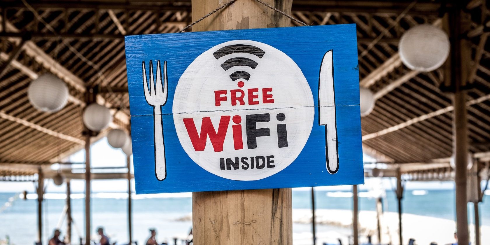 A Hang Sign Showing Free Wi-Fi Inside Hanging in a Seaside Restaurant