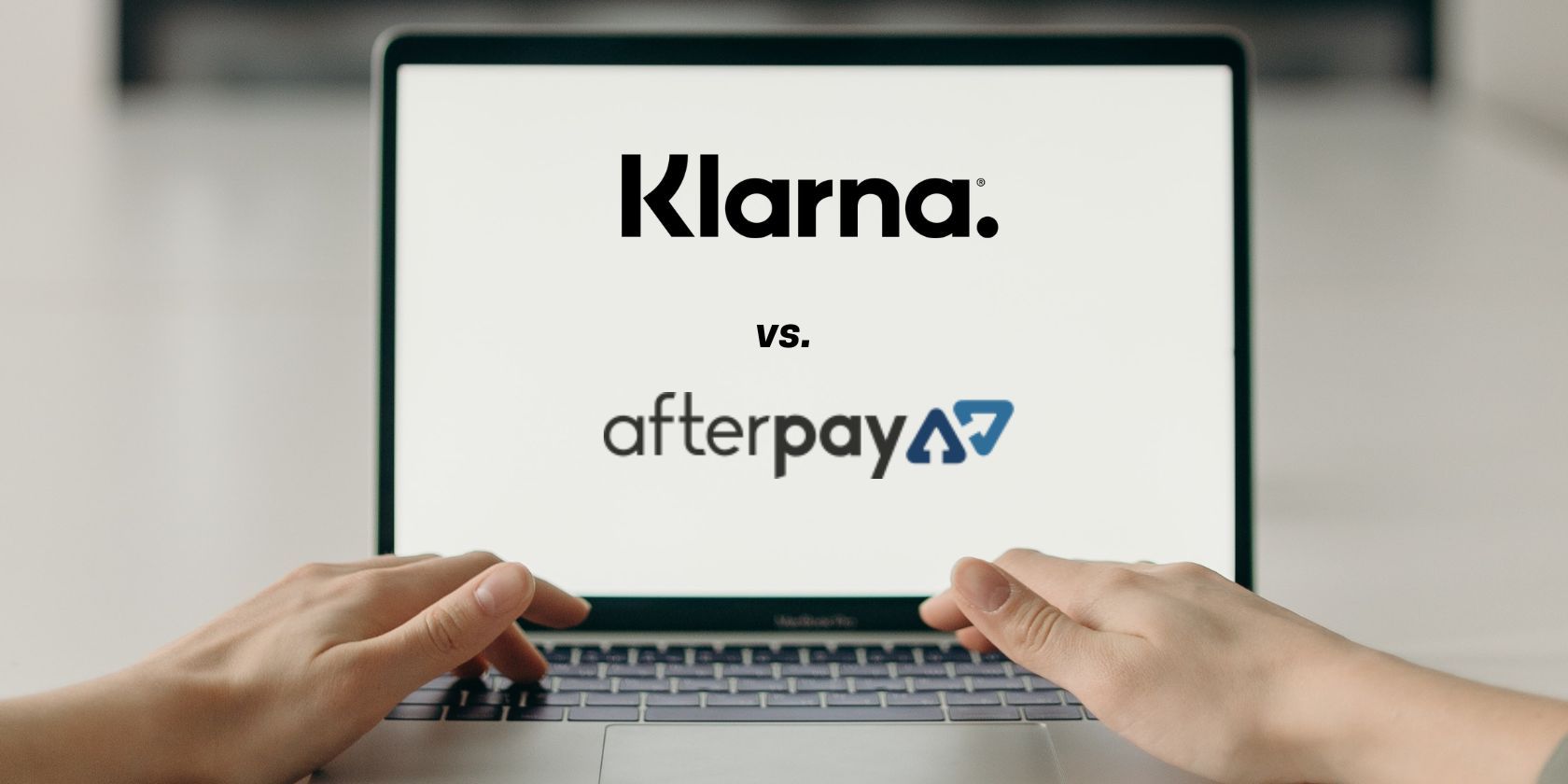 klarna and afterpay logos on laptop screen being used by person