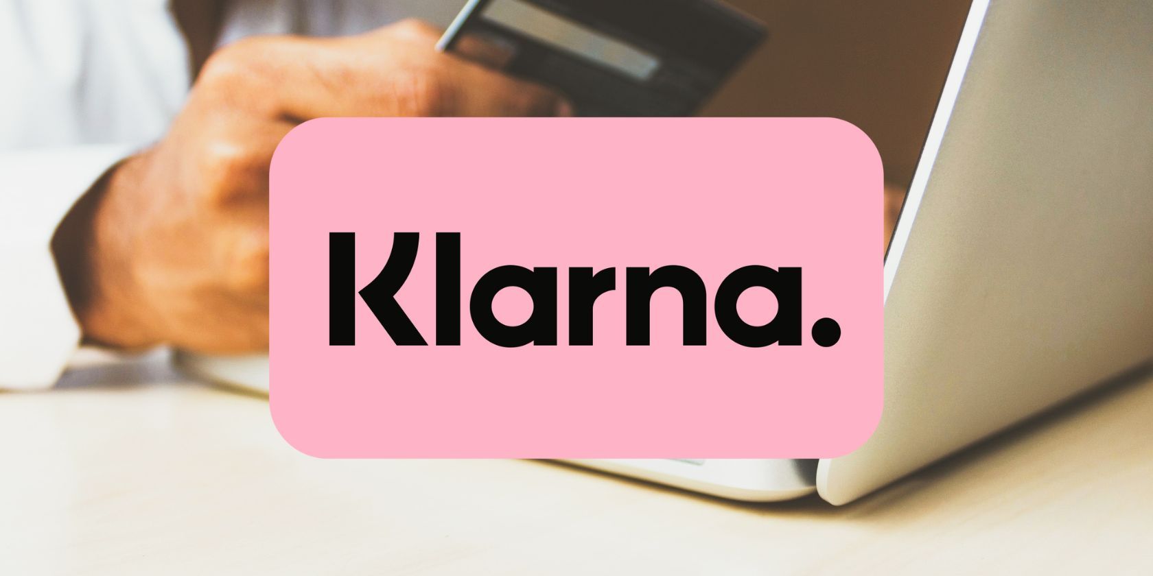 klarna logo in front of person online shopping