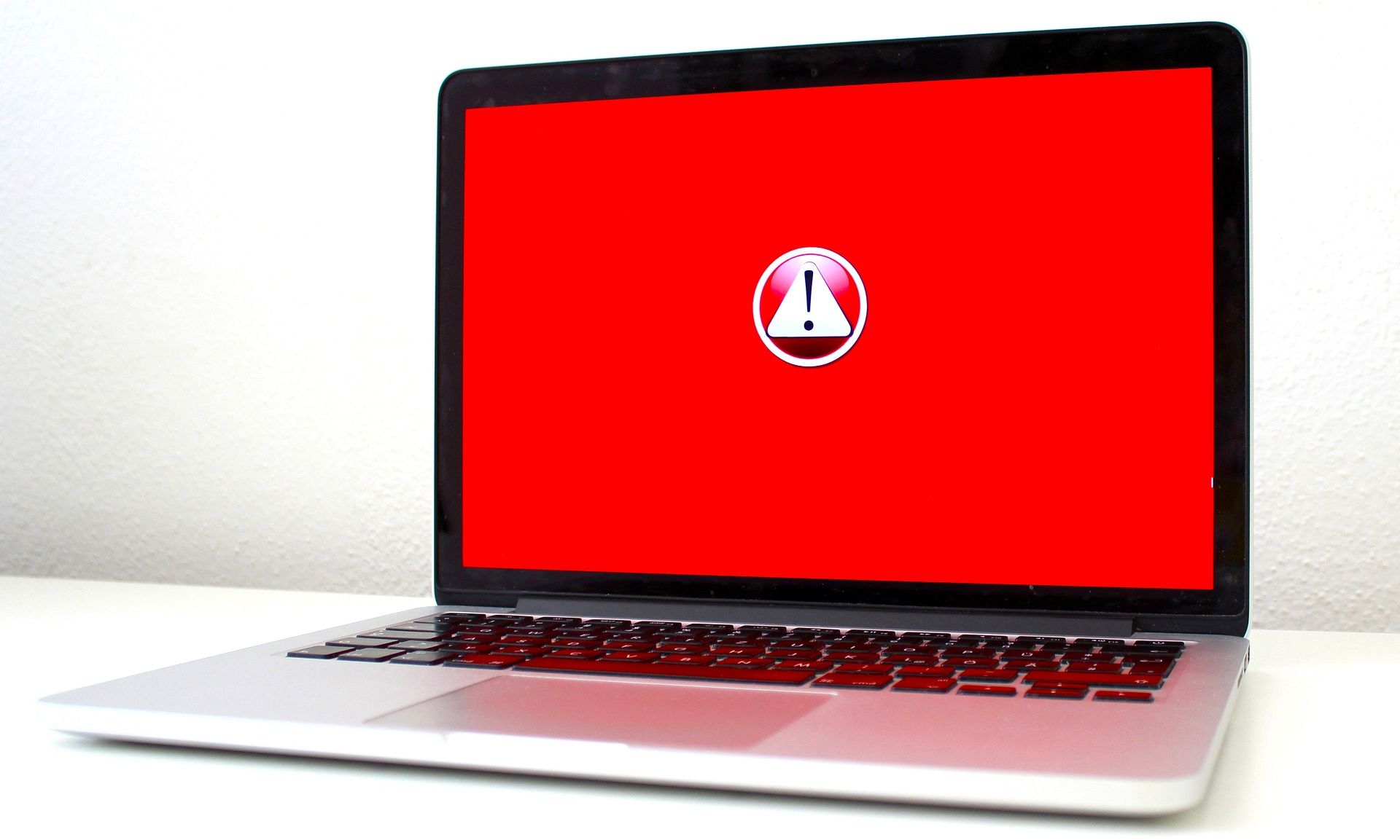 red malware warning on laptop