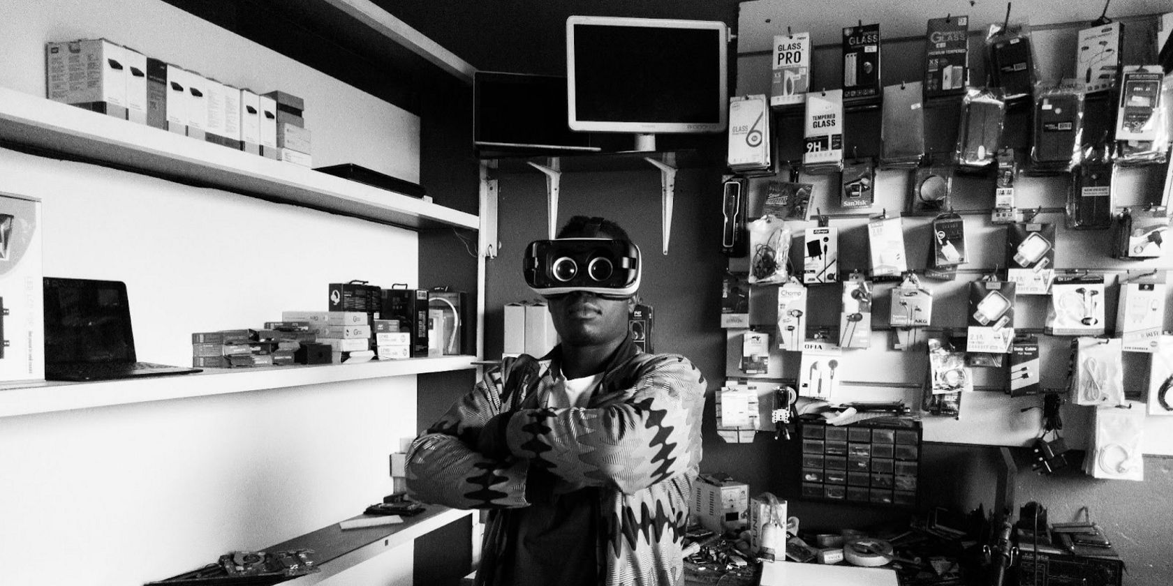 A man wearing VR goggles in an electronic store