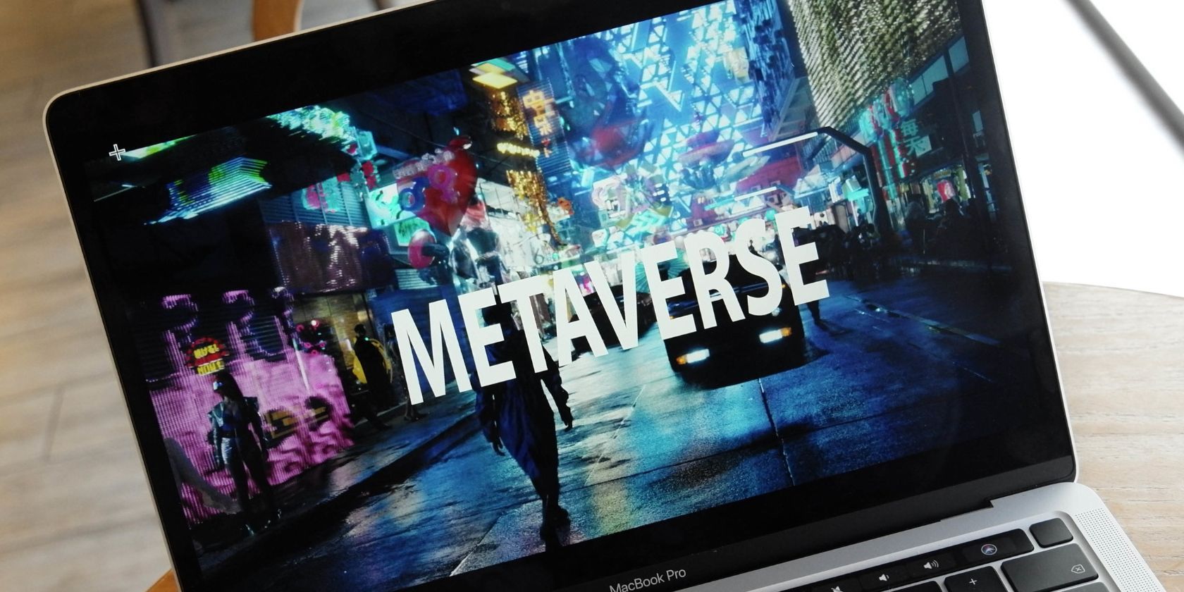 digital metaverse graphic on laptop screen