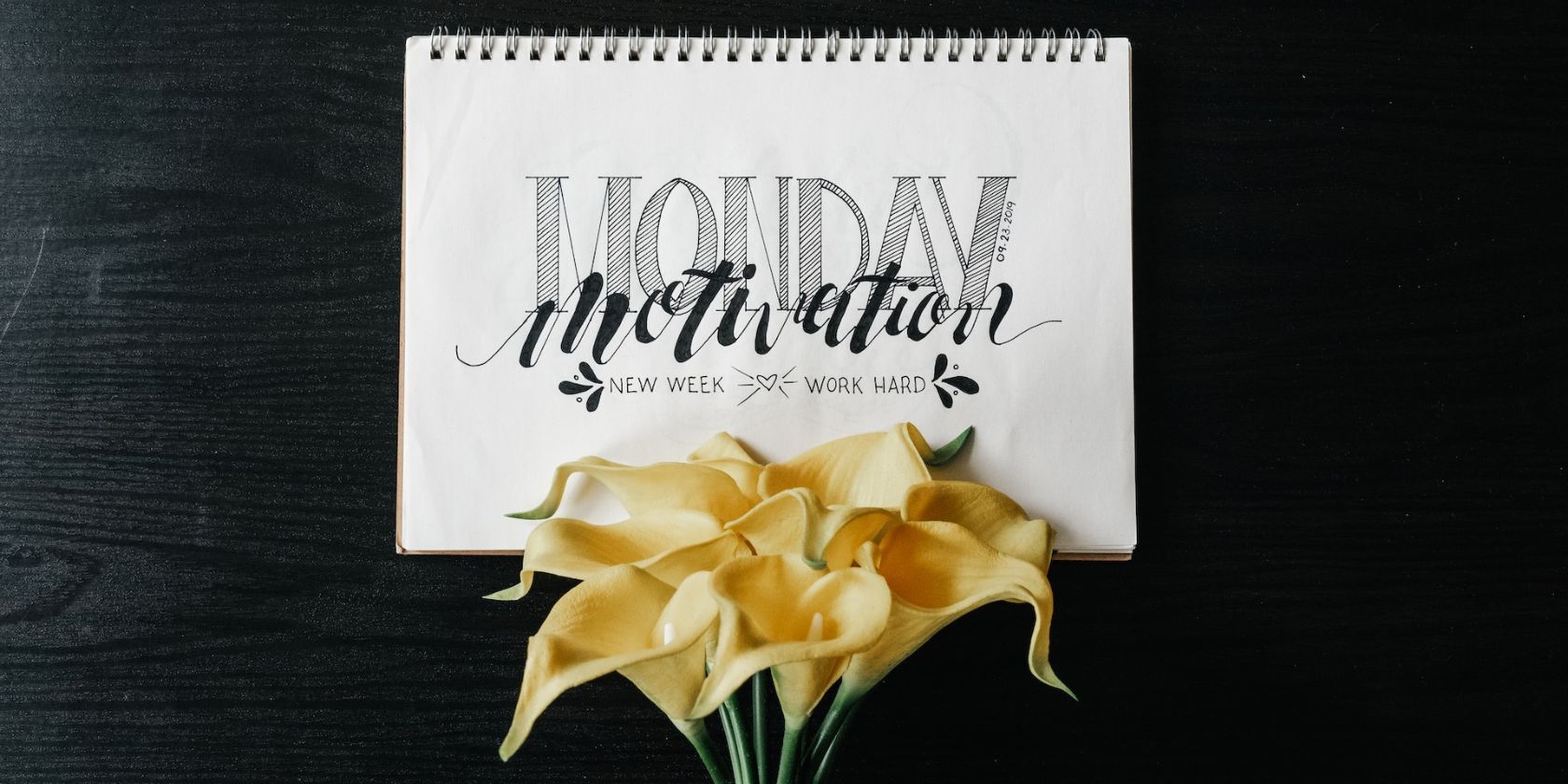 a Monday motivation note with yellow flowers 