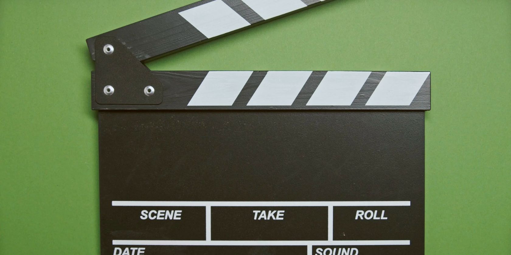 movie clapper board against green background
