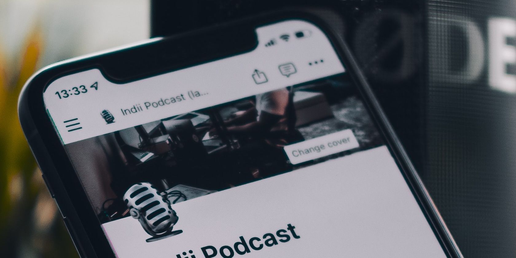 Photo of Notion open on a smartphone in a podcasting studio