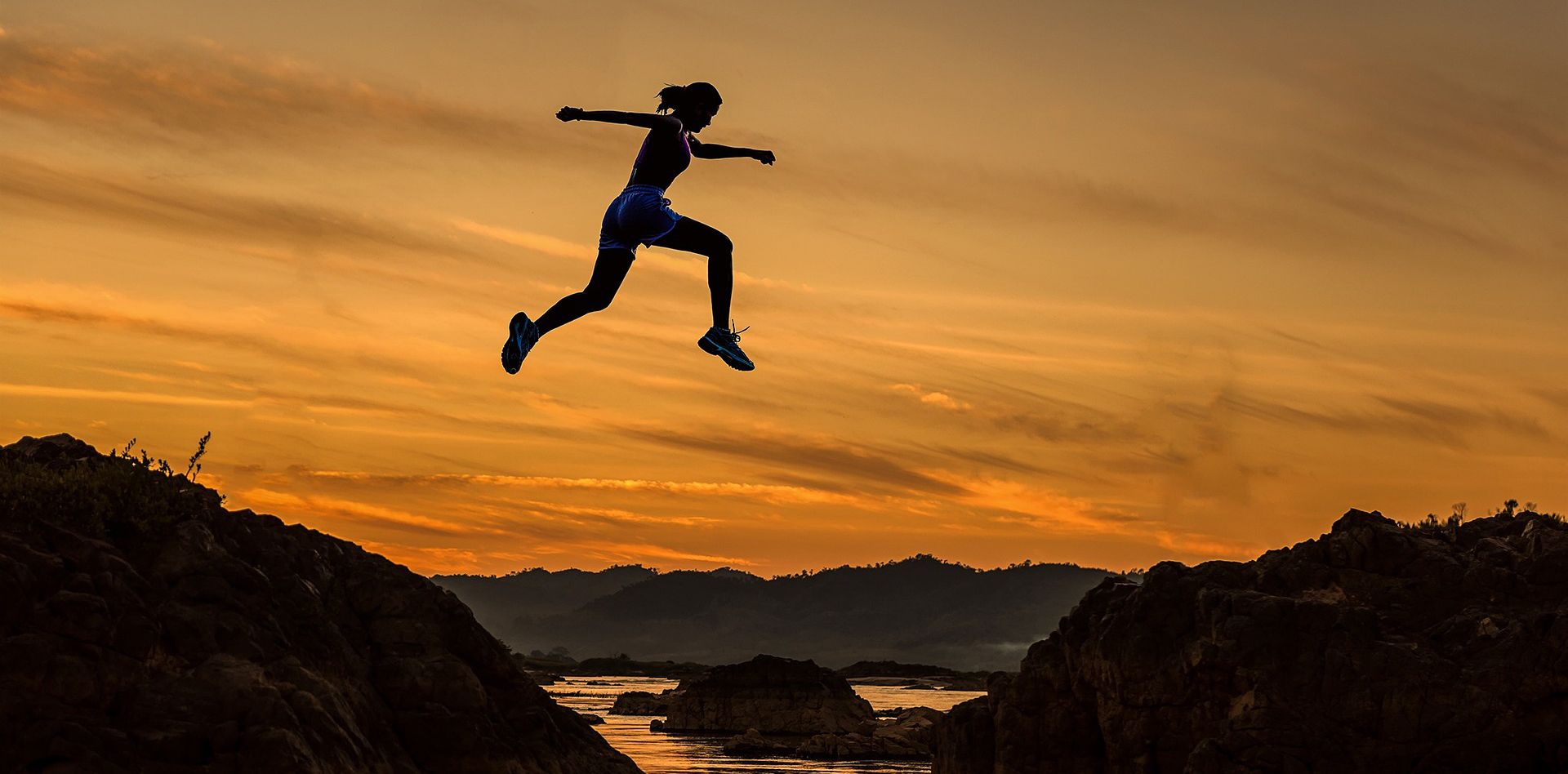 Picture of woman leaping across a chasm