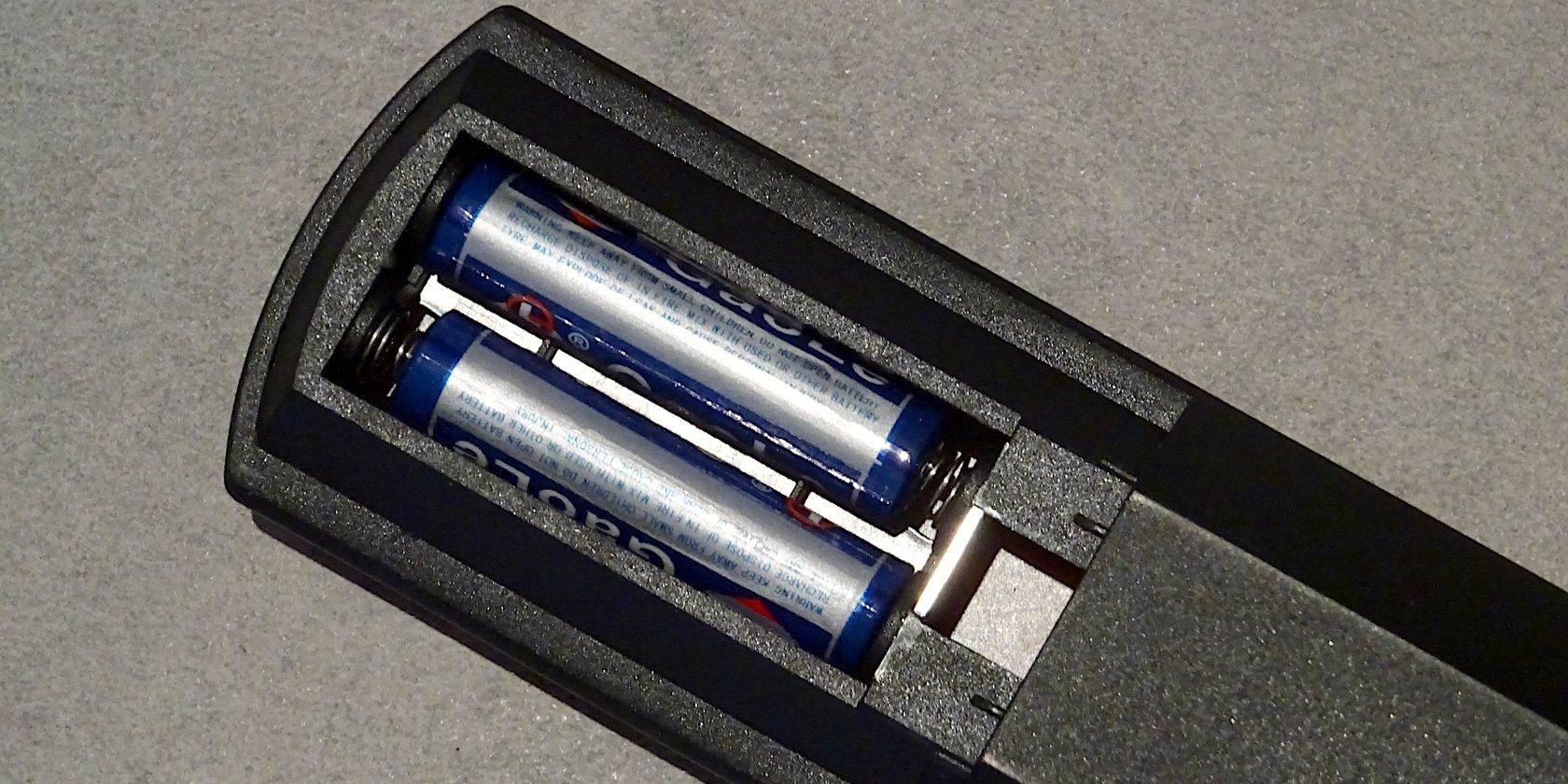 Remote control battery compartment containing two 1.5 batteries in series