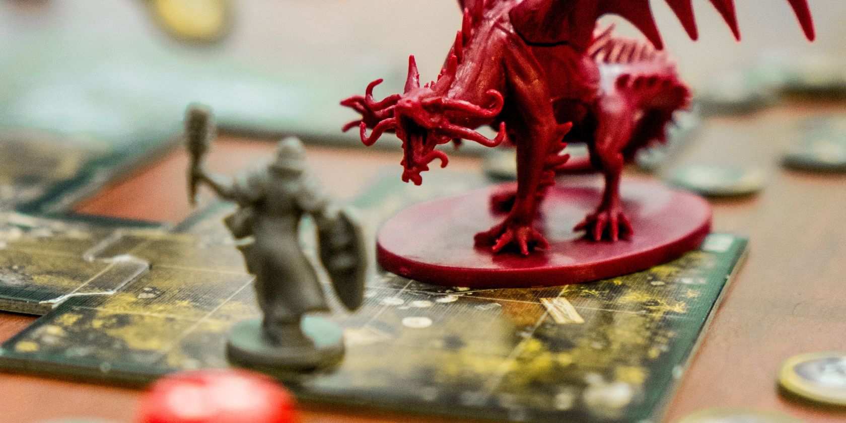 RPG character tokens engaged in combat on a cutout tabletop battle map