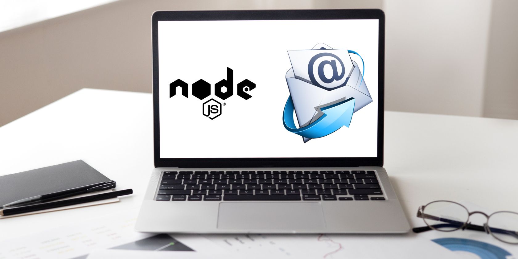 An open laptop with the Node.js logo displayed on screen, alongside an icon representing email