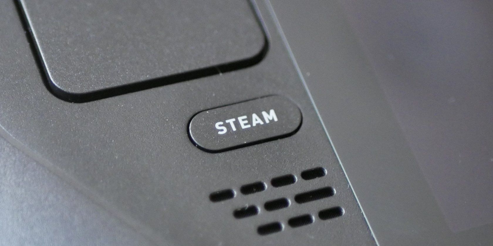 Botão Steam em um Steam Deck.