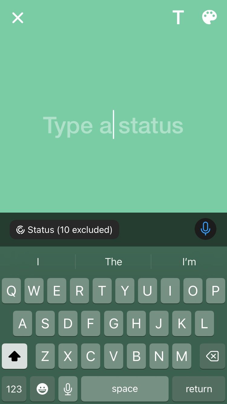 Typing a WhatsApp status update on iPhone