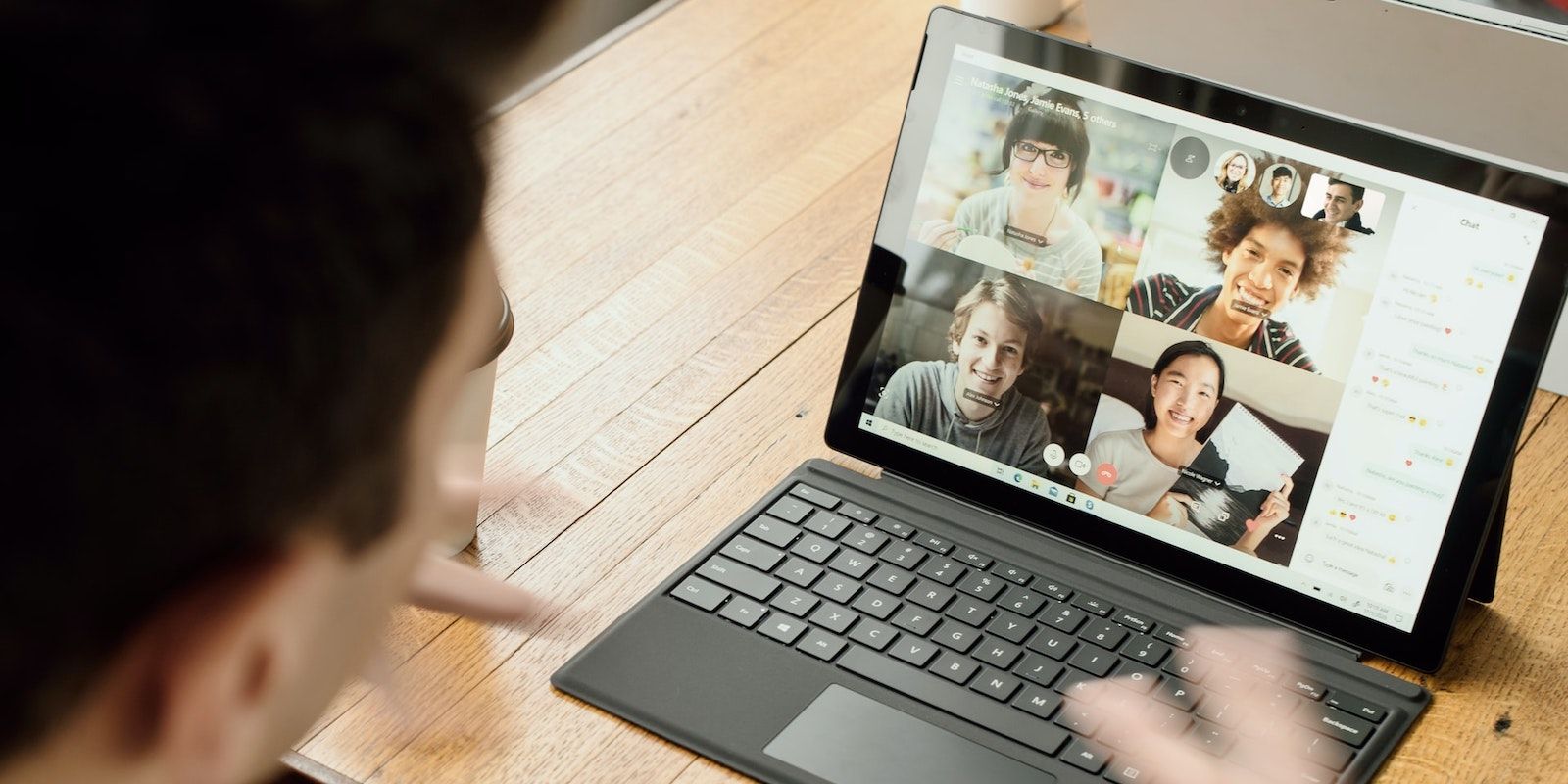 Five People on Video Call on Tablet