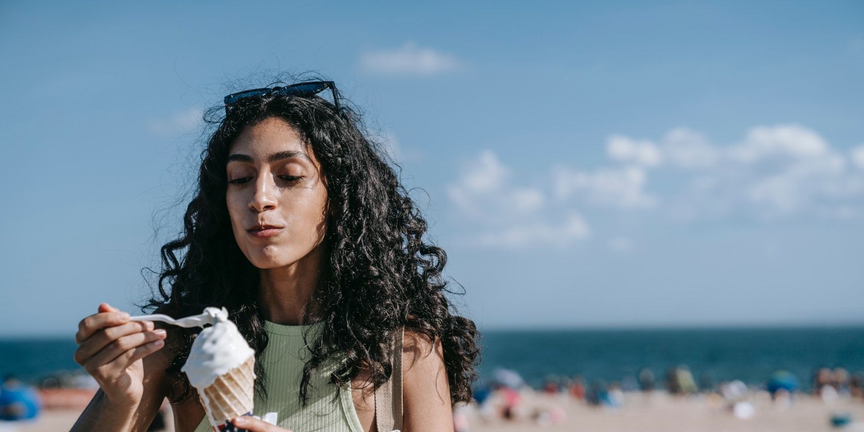 woman eating vanilla ice-cream cone