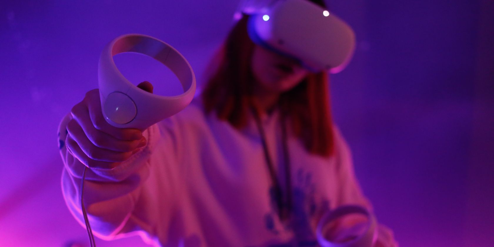 Woman using a Quest 2 virtual reality headset