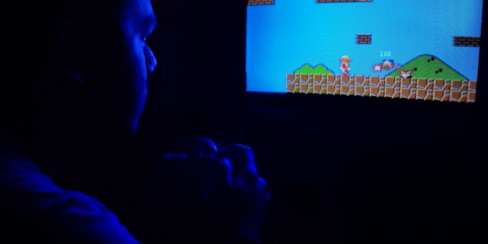 A man playing Super Mario Bros