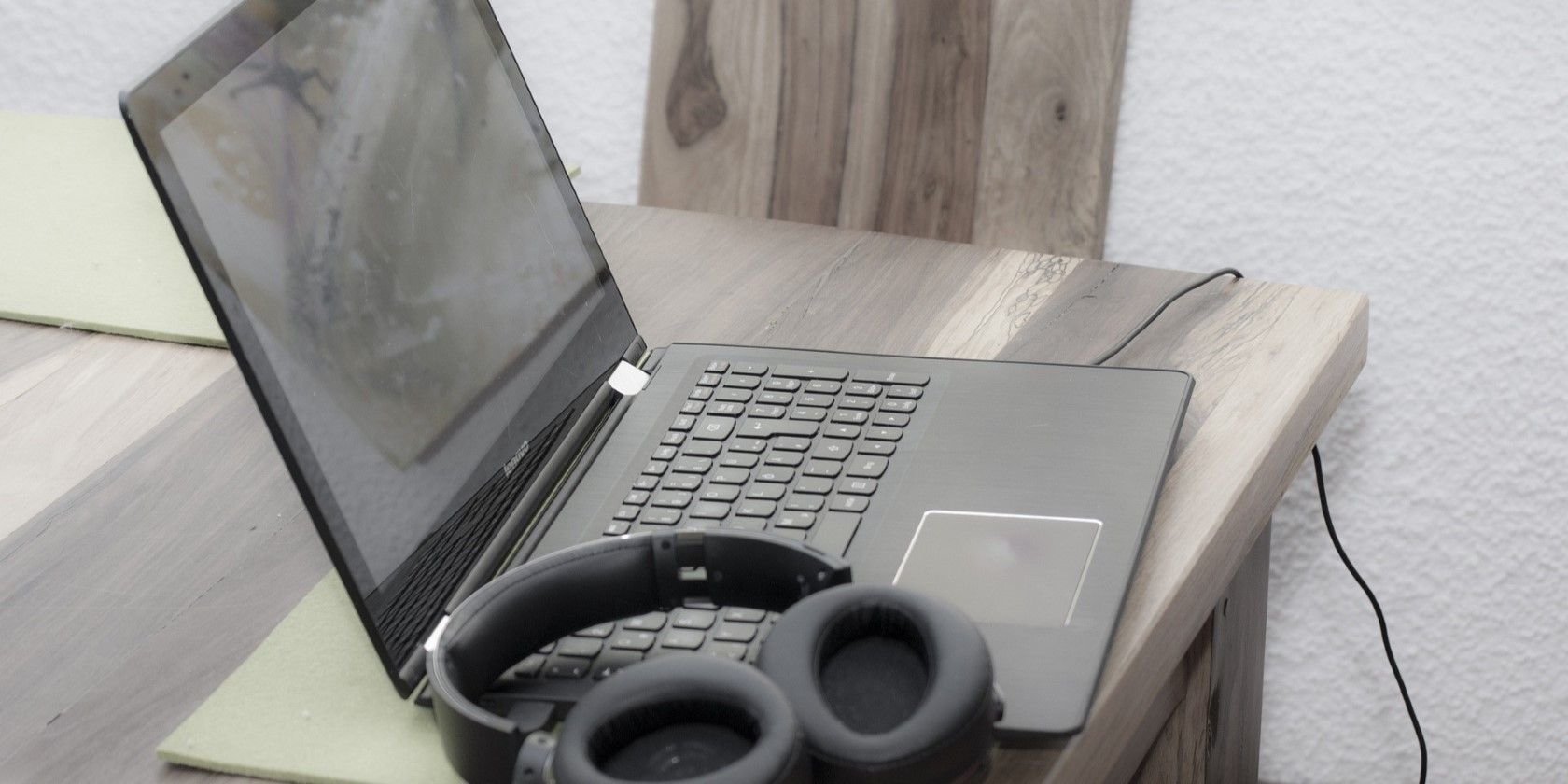 A Windows laptop on a table with headphone