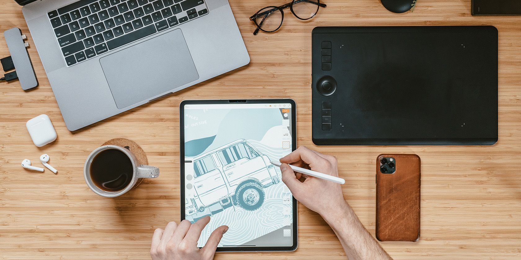 Drawing tablet and laptop on a table