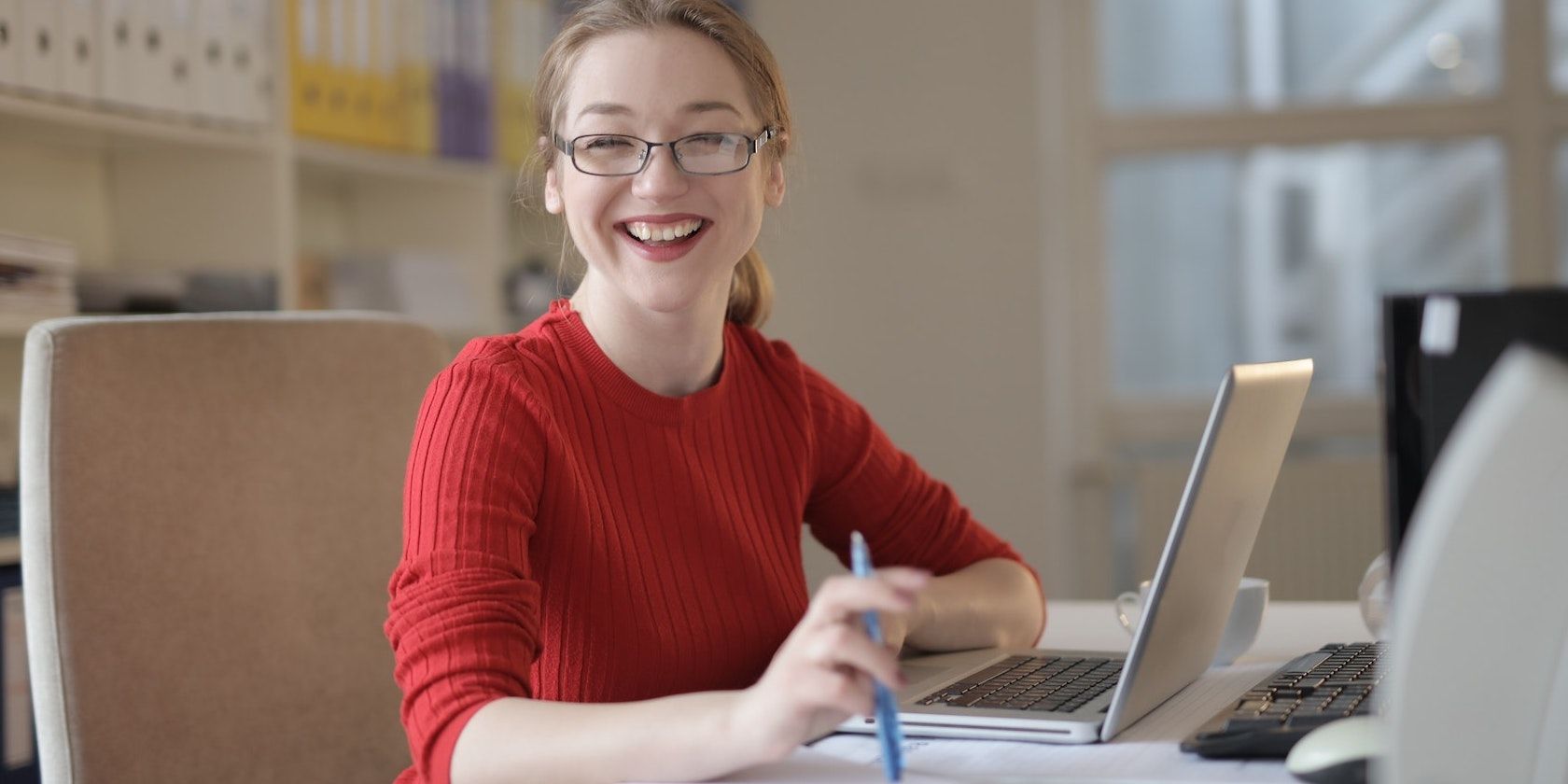 Smiling Woman on Work Desk
