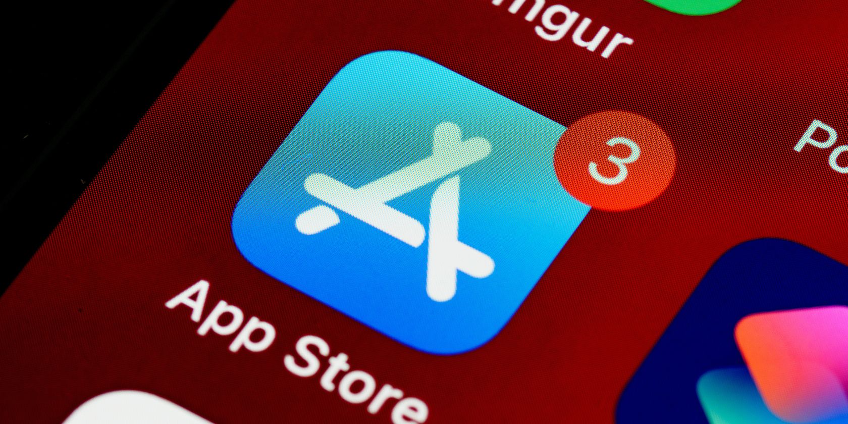 A close-up of an iPhone screen showing the App Store icon. 