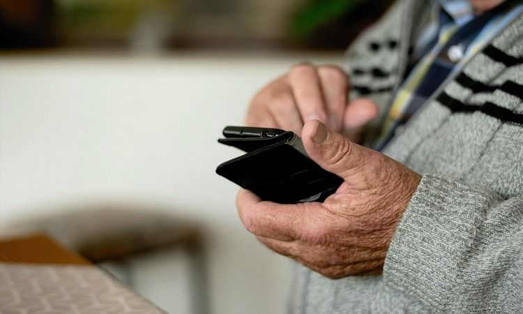 Elderly man on his phone