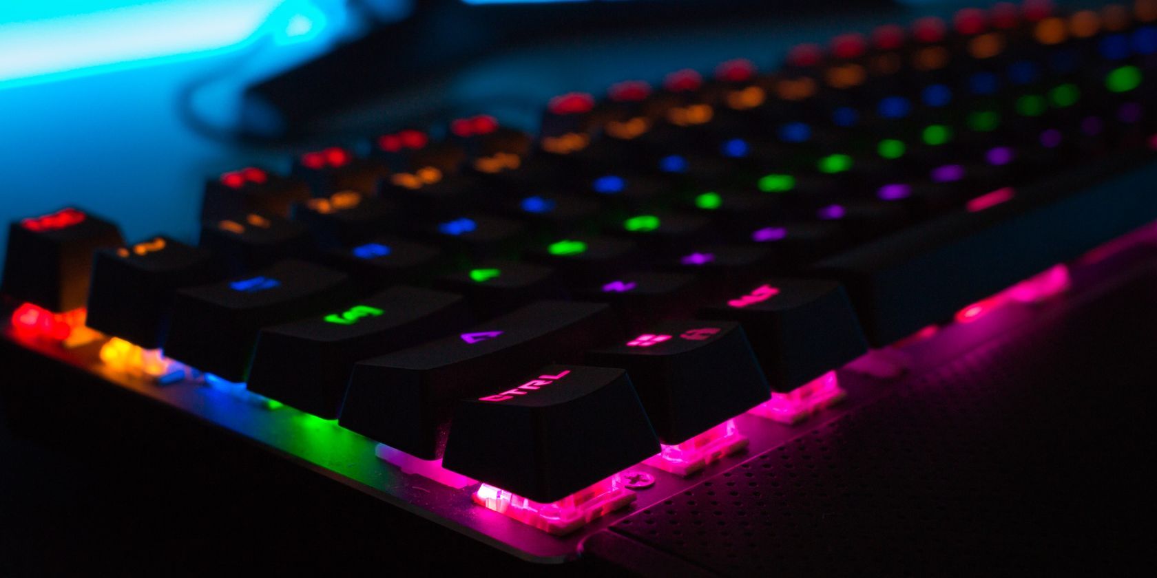 close up shot of rgb keyboard in dark room