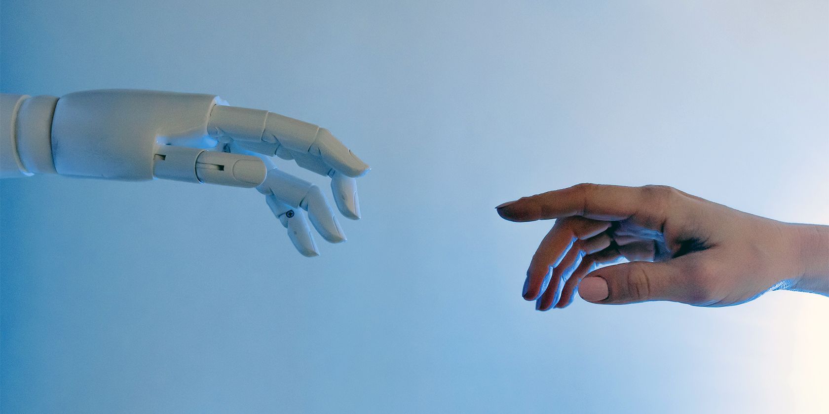 Robot hand reaching out to a human hand