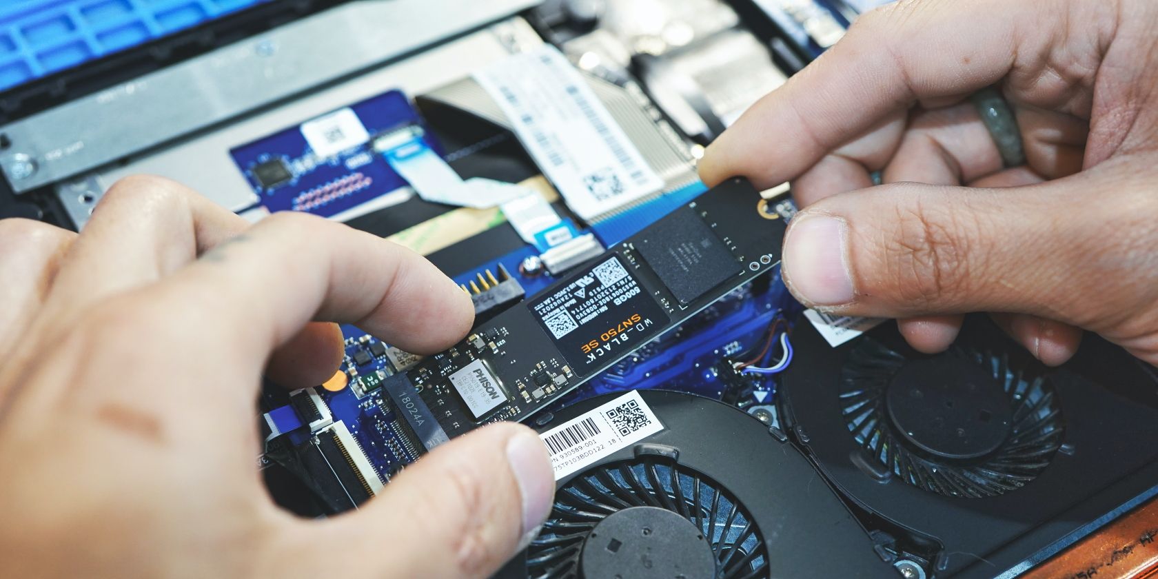 a man holding SSD in hand