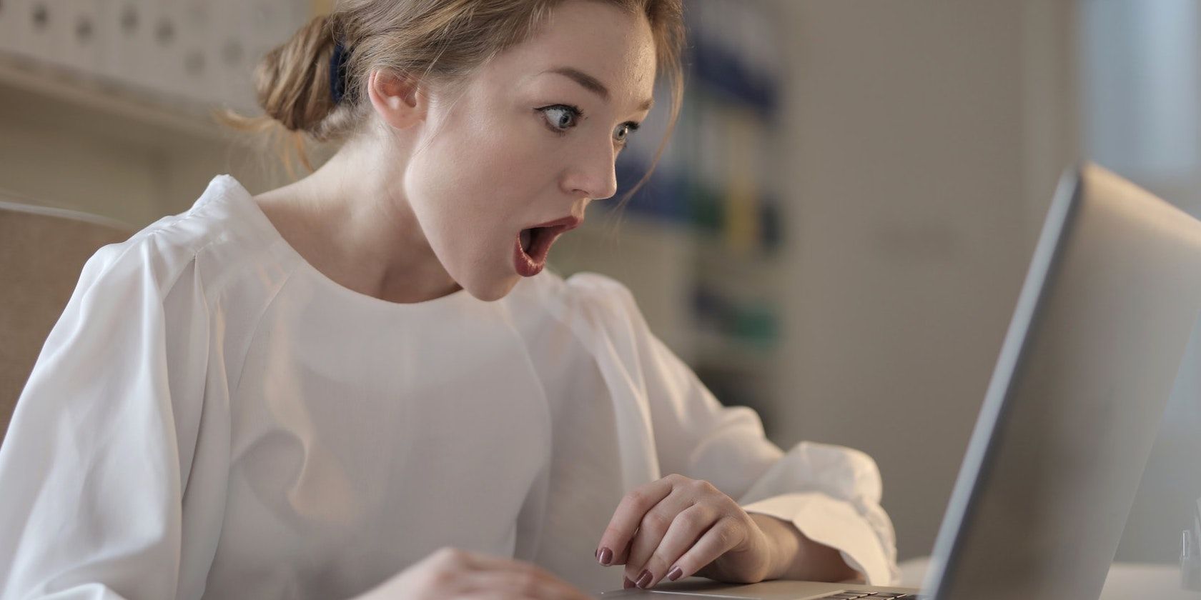 Woman surprised on computer