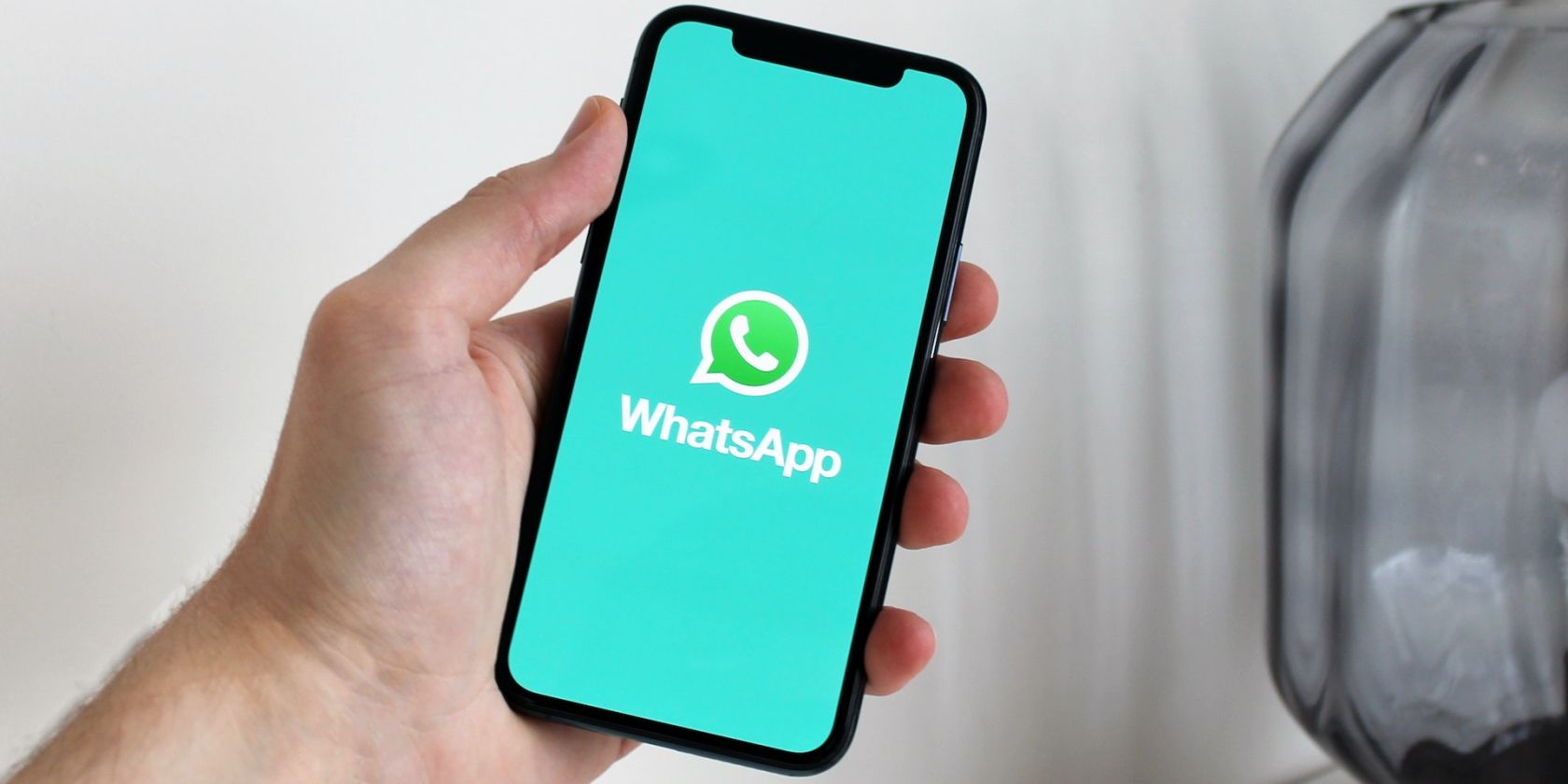 How can I use two WhatsApp accounts on my iPhone?