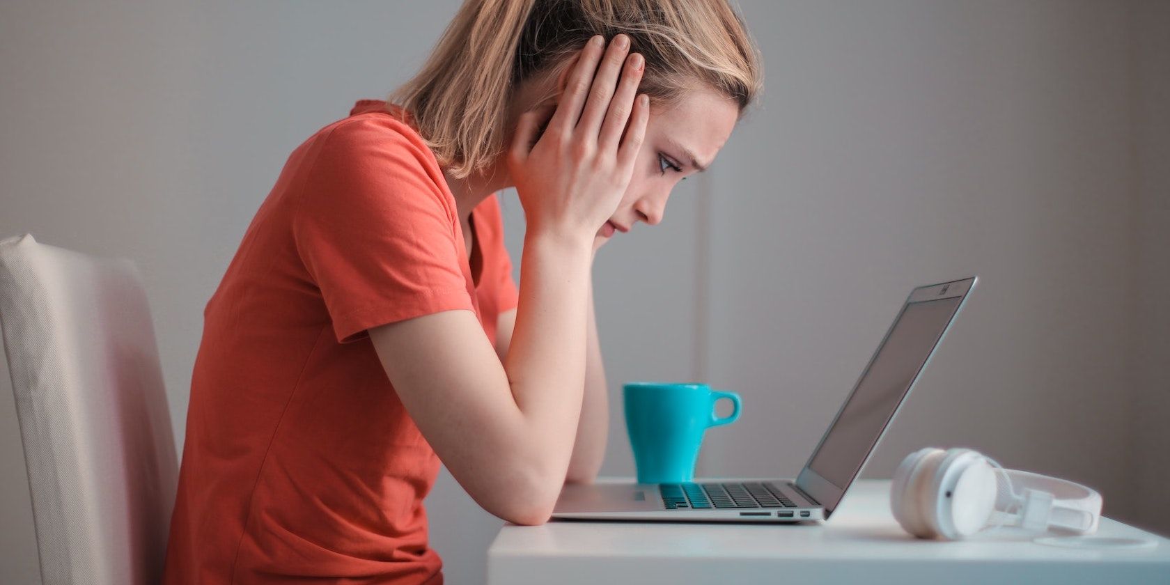 Worried Woman Staring at a Laptop