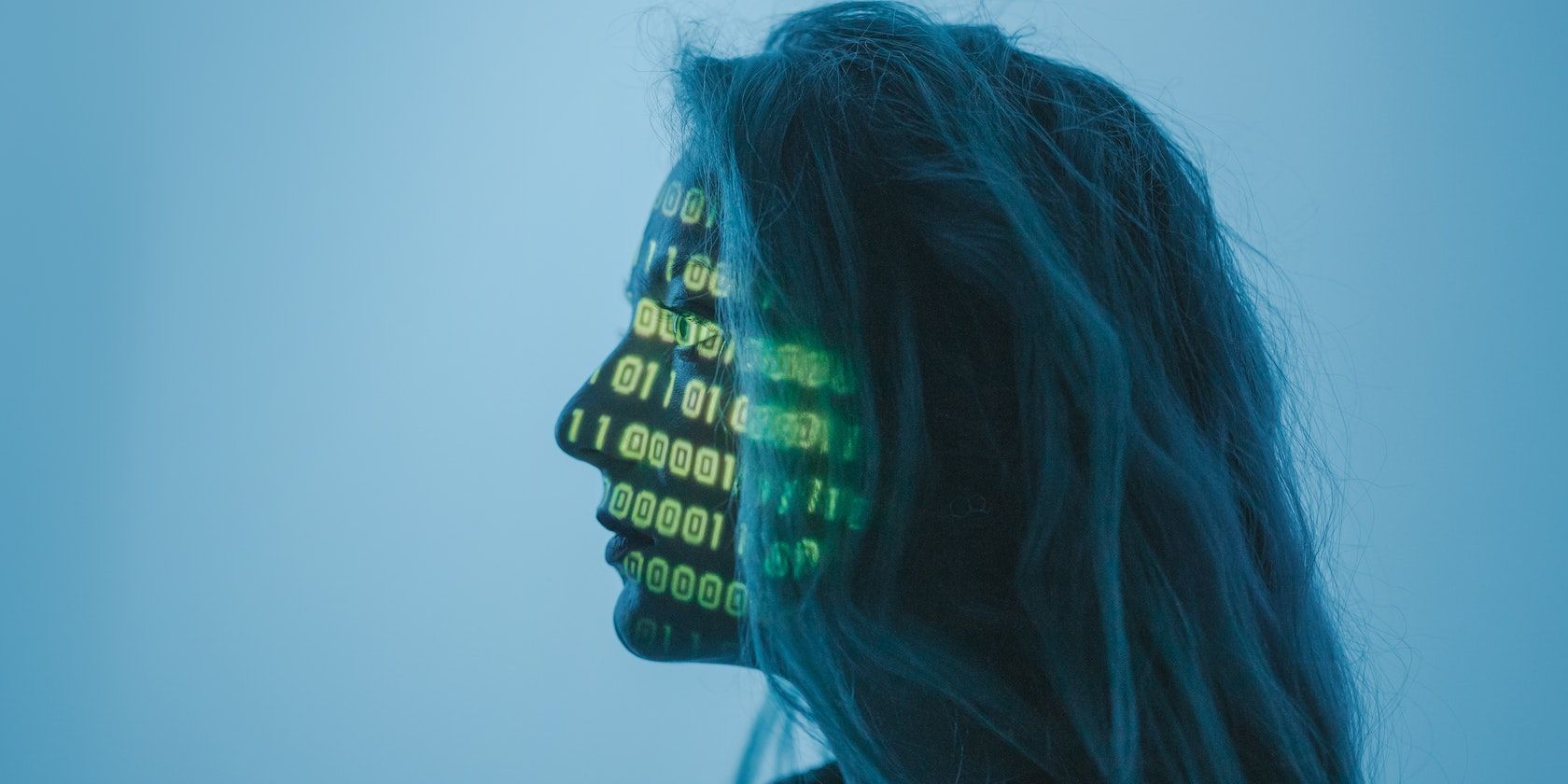 A woman with binary codes on her face