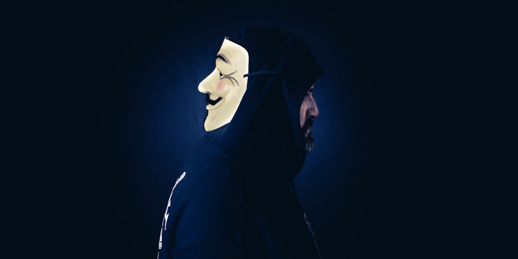 a man in a black hood and a mask