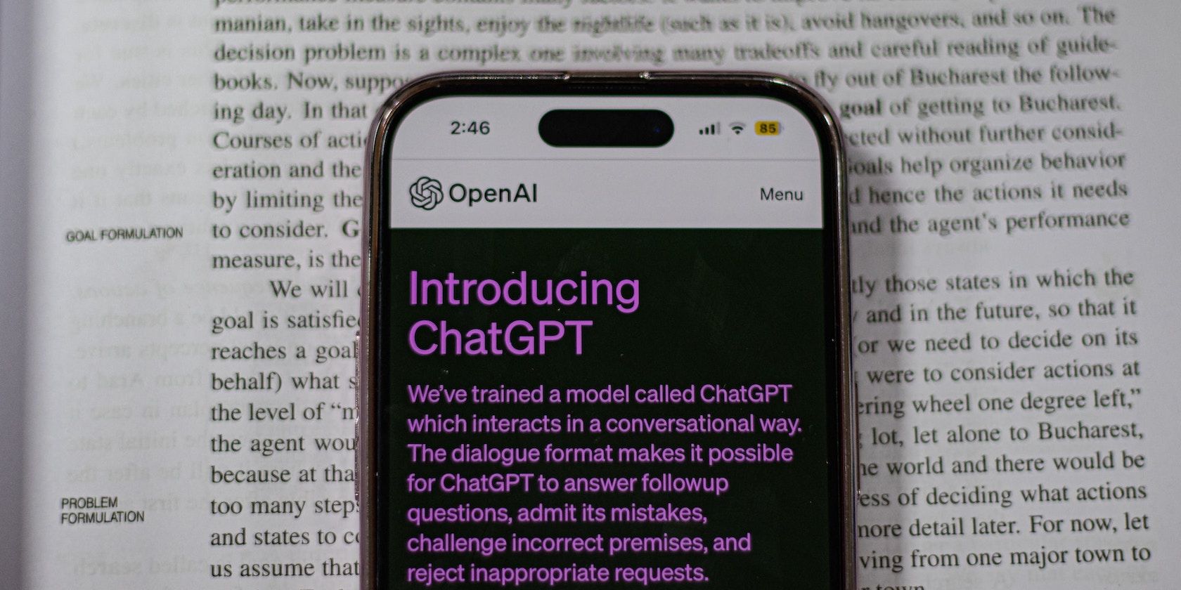 Smartphone With ChatGPT on Top of a Book