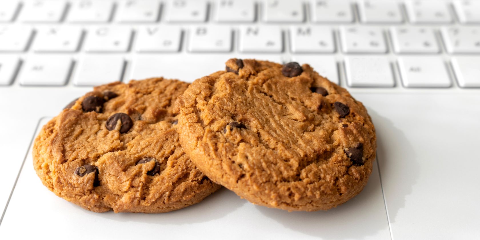 cookies sitting on a white keyboard feature