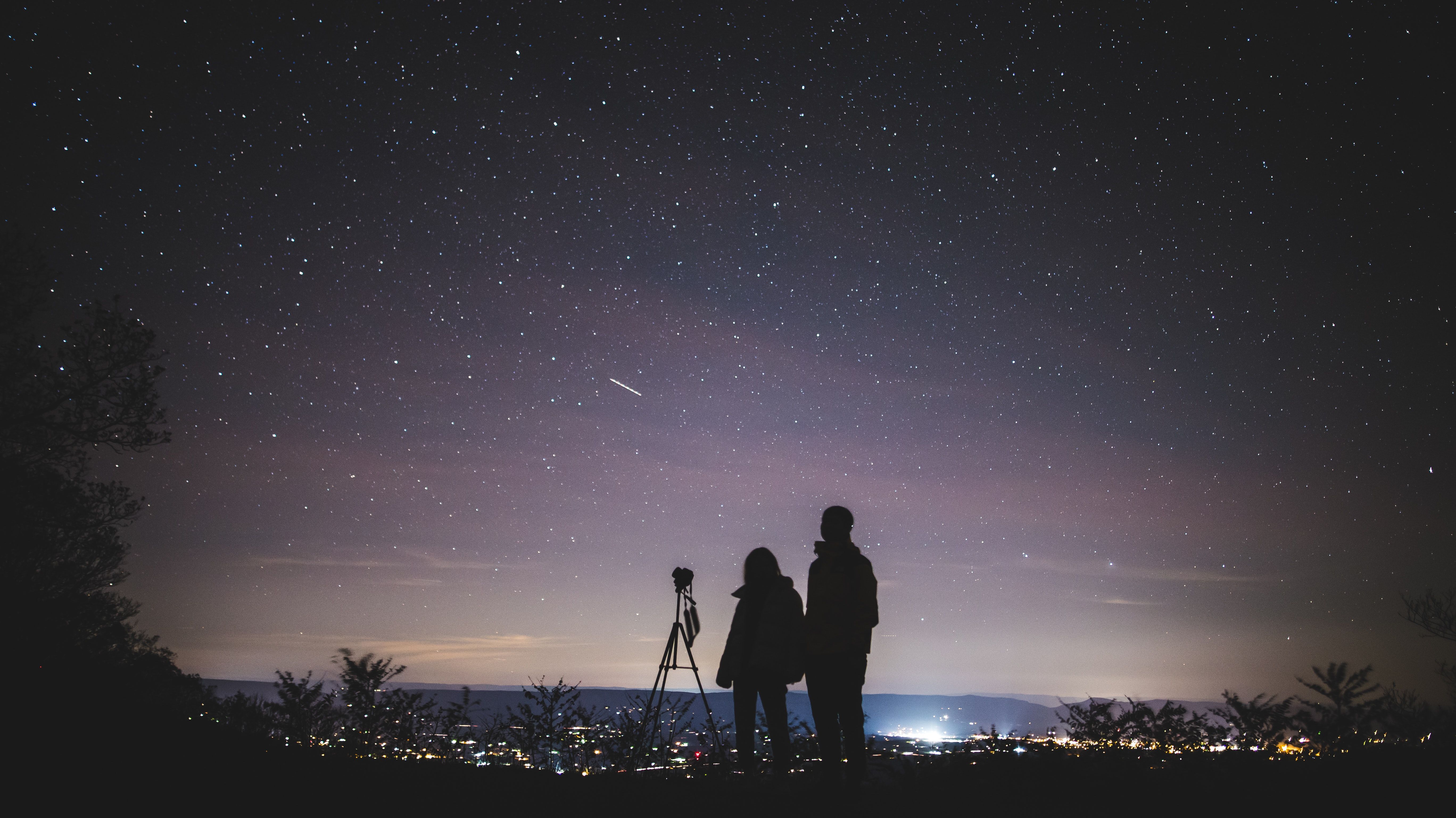 Couple Taking Landscape Astrophotography Shot at Night