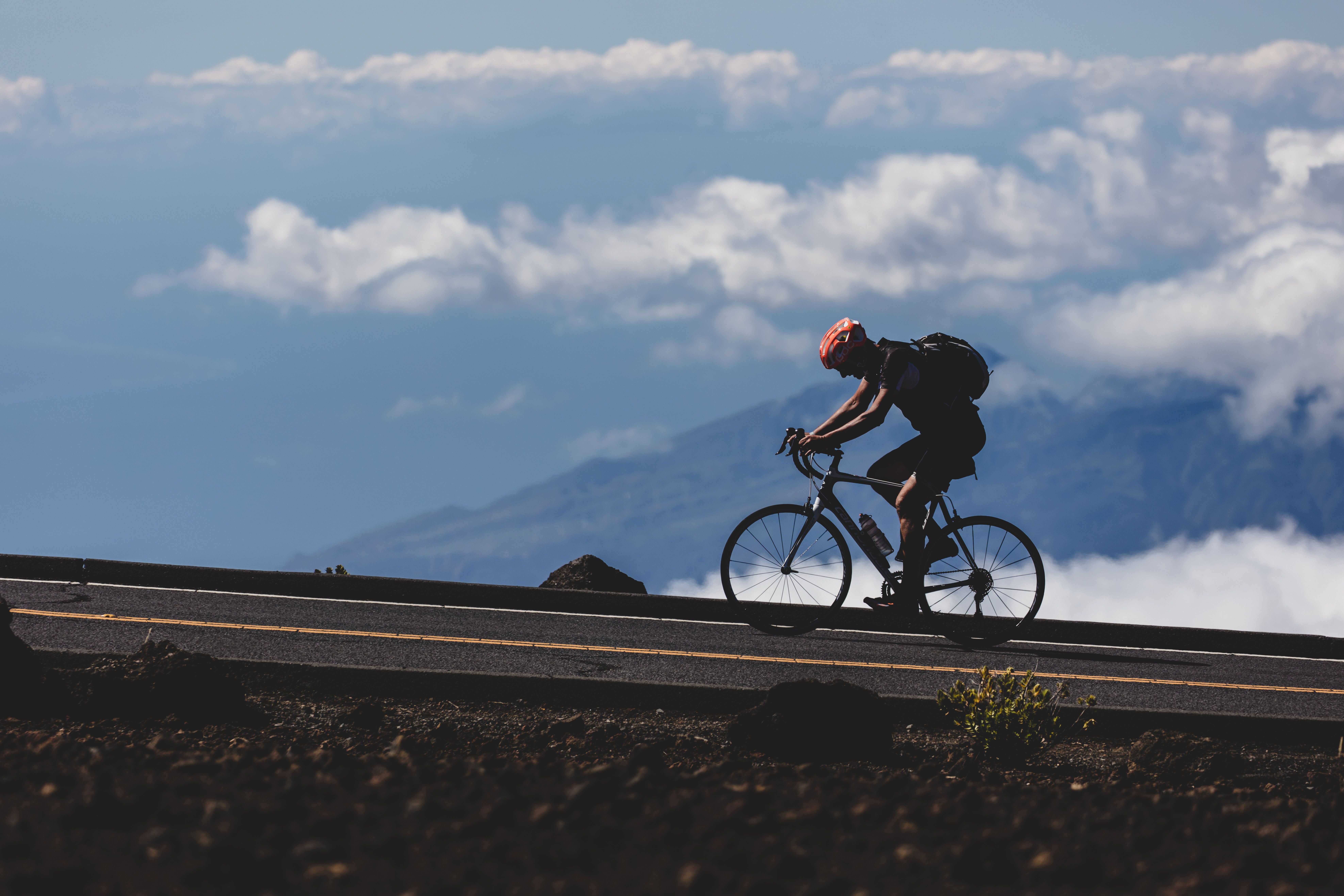 cyclist climbing a mountain road