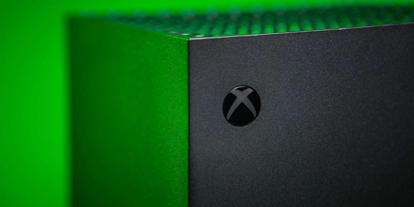 A close up photograph of an Xbox Series X highlighting the power button 