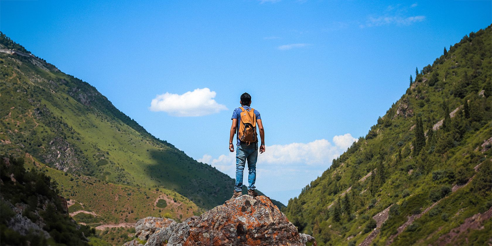 Man gazing at distant hills