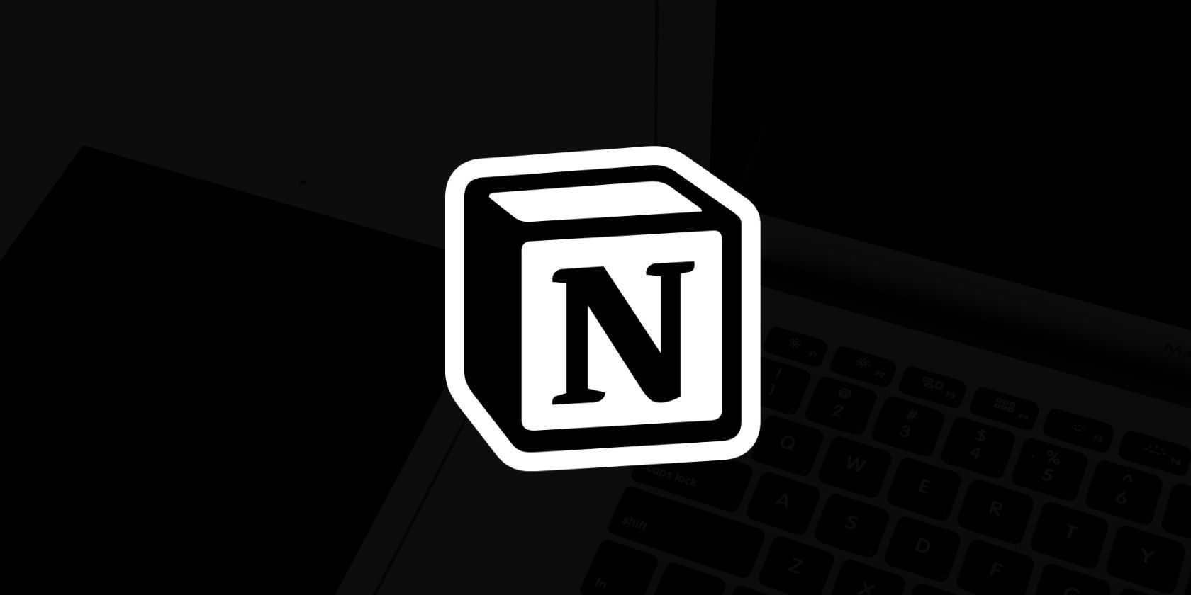 Laptop and tablet on a desk with Notion logo overtop