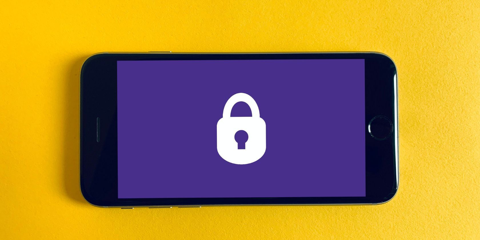 smartphone on yellow background with lock icon on screen