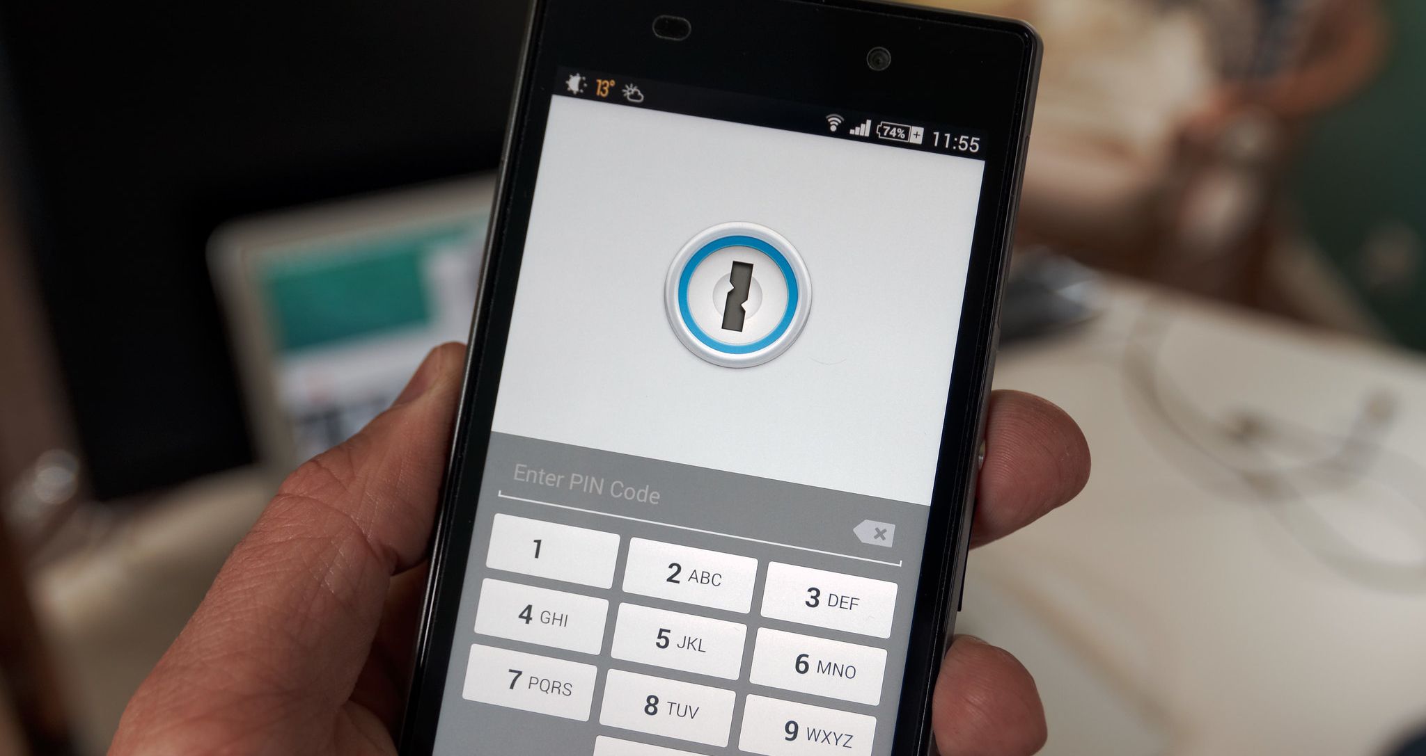 person using password manager on smartphone
