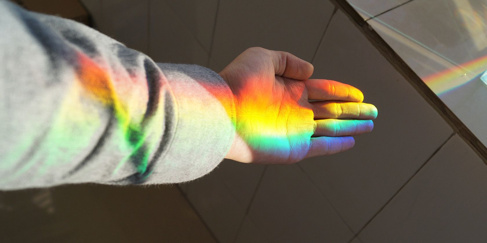 Rainbow reflecting on a hand